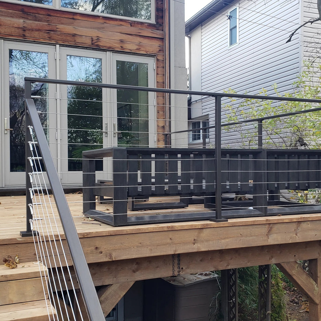 Black metal post cable railing project in Mississauga, Ontario
